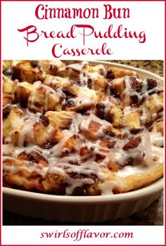 cinnamon bun bread pudding casserole with icing in a white dish on a granite countertop