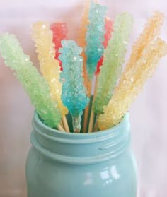 colorful candy sticks sticking out of a jar