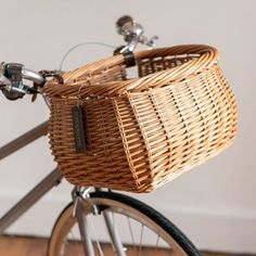 a wicker basket on the back of a bicycle