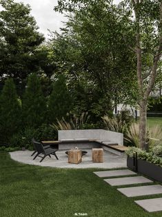 an outdoor seating area in the middle of a yard