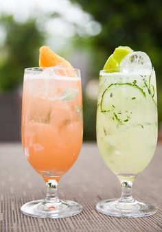 two drinks sitting on top of a table next to each other