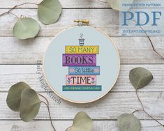 there is a cross stitch pattern on the hoop with some leaves around it that says, so many books so little time