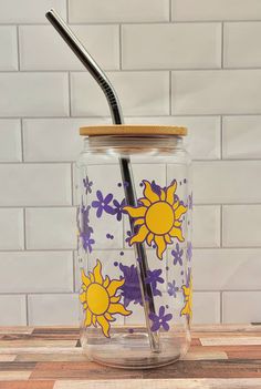 a glass jar with a straw in it