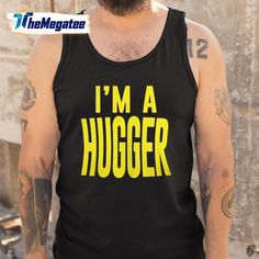 a bearded man wearing a black tank top that says i'm a hugger