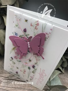 a card with a pink butterfly on it