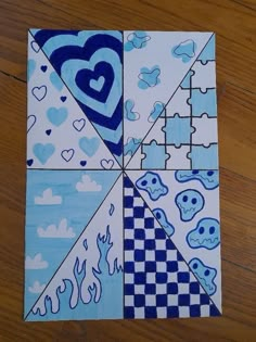 a piece of paper that has been cut into squares with blue and white designs on it