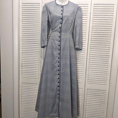 Vintage Handmade Coat Dress, Full Length Blue With Embroidered Contrasting Dots Full Button Front, Gorgeous Translucent Decorative Buttons Navy Blue Piping Sewn In Muslin Cotton Lining Set In Waist With Deep Pleating In Back 3/4 Sleeve Modest Crew Neckline Very Well Made Theatrical Quality Dress Heavy, Weighs 5 Pounds Condition Is Amazingly Good With Only 1 Small Spot On Front. I Have Not Tried To Spot Treat For Fear Of Further Damage. Would Have It Professionally Treated Era Very Hard To Identify As It Qualifies As Modest, Pioneer, Frontier Style Or Overcoat Full Length Coat, Quality Dresses, Decorative Buttons, 5 Pounds, Muslin Cotton, Coat Dress, Crew Neckline, Dress Making, Vintage Dresses