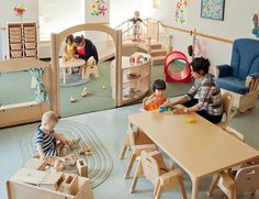 children playing with wooden toys in a playroom