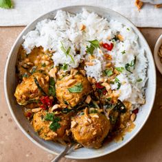 a white bowl filled with rice and meat