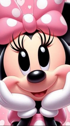 a cartoon minnie mouse with a pink bow on it's head and big eyes