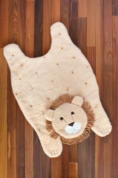 a stuffed animal laying on top of a wooden floor