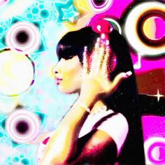 a woman with her hand on her face in front of colorful circles and stars behind her