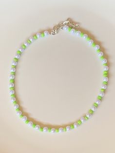 Cute, summery, fun, trendy, adjustable, lime green bead pearl choker. Length: 13.5-16 in. Custom sizes available. Handcrafted. Green Handmade Pearl Necklace, Green Round Beads Jewelry For Summer, Handmade Green Casual Necklaces, Casual Green Handmade Necklaces, Casual Green Handmade Necklace, Summer Green Jewelry With Round Beads, Adjustable Green Choker Necklace, Casual Green Choker Jewelry, Green Beaded Necklaces For Summer