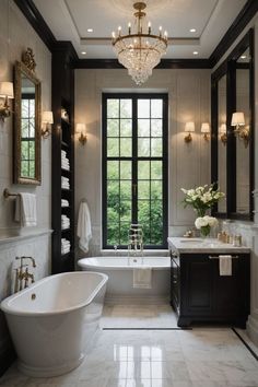 a bathroom with a tub, sink and chandelier