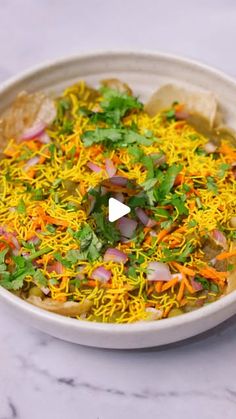 a white bowl filled with food on top of a table