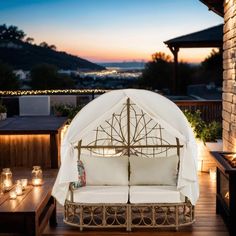 a white couch sitting on top of a wooden deck