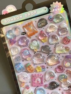 a package of various colored buttons in it's packaging