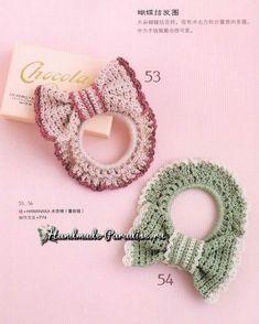 two crocheted hair clips are shown on a pink background, one is green and the other is red