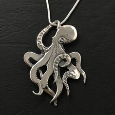 Octopus Pendant  Made in Adelaide SA by Michael Davidson Solid Sterling Silver  43mm x 32 mm    medium sized Optional snake chain 45 cm   (different length by request) Gift box available as seperate item $5, included with snake chain option Aluminium Jewelry, Octopus Sketch, Octopus Jewelry, Octopus Ring, Fish Pendant Necklace, Octopus Necklace, Octopus Pendant, Aluminum Jewelry, Silver Clay