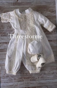 Classic christening outfit, our rompers are great for hot weather. Elegant 6 piece christening outfit soft Poly-Shantung silk , inside fully lined for fresh comfort. Include quarter sleeve shirt full of hand stitched details with back button closure. Beautifully decorated collar. Romper pants are long to the ankle, wide style fit pants with elastic waistband for better fit. Easy button opening on romper from inside ankle. Removable long sleeve jacket with hand decorated lace. Matching hat with h Vintage Baptism, White Baptism Dress, Outfit With Hat, Christening Outfits, Shirt Romper, Baptism Gown, Vintage Romper, Christening Outfit, Baby Boy Clothing Sets