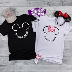 This Disney High School graduation inspired t-shirt features Mickey Mouse and/or Minnie Mouse ears, ready to celebrate the big day. The shirt is perfect for the Grad Night celebration at Disneyland, Disney World's Epcot Center etc. and makes for a great senior picture outfit. Show off your Disney pride and excitement for the next chapter in life with this fun and unique shirt. The colors can come in the color of your choice. Mickey Mouse Graphic Tee For Disney-themed Events, Black Minnie Mouse Short Sleeve T-shirt, Cheap Minnie Mouse T-shirt For Disney Trips, Custom Disney Shirts, Disney High Schools, Grad Shirts, Disney Honeymoon, Disney Minnie Mouse Crew Neck T-shirt, Disney High