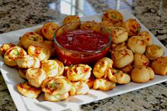 there is a platter of food on the table, including shrimp and potatoes with ketchup