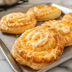 some food that is sitting on a metal tray and ready to be baked in the oven