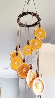 orange slices hanging from a chandelier made out of branches