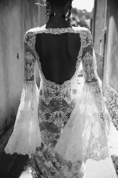 the back of a woman's dress in black and white