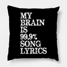 a black pillow with the words my brain is 99 % song lyrics printed on it