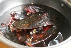 some food is sitting in a pot on the stove top and ready to be cooked