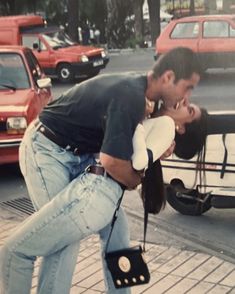 a man kissing a woman on the street