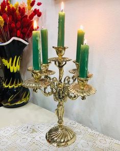 a gold candelabra sitting on top of a table