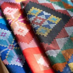 three different colors of fabric sitting next to each other