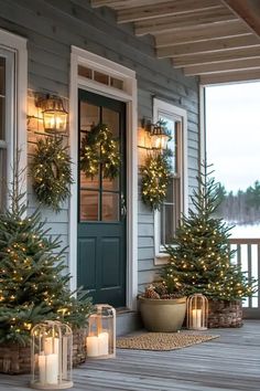 christmas trees on the front porch with lit candles