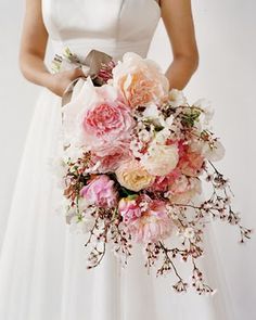 a woman holding a bouquet of flowers on her wedding day, with the caption instagram