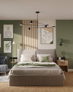 a bedroom with green walls and wood flooring is pictured in this image, there are pictures on the wall above the bed