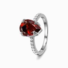 About This Ring
Let the sumptuous hues of the Garnet Ring - Nymph inspire your every day. The stone of passion, this authentic Moon Magic Garnet is surrounded by five delicate, genuine White Topaz on each side.   
This ambitious piece will surely turn some heads, and perhaps some hearts.Details
- Authentic Moon Magic Garnet- Stone Size: 0.31" x 0.39" (8mm x 10mm)- Cut: Pear-shaped brilliant cut - Gem authenticity approved by GIA
How To Style 
A vampy stapl Red Gemstone Ring, Garnet Gem, Gem Diamonds, Red Gemstones, Garnet Ring, Moon Magic, Garnet Stone, Moonstone Necklace, Garnet Rings