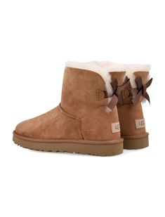 Mini Bailey Bow Ii Boots By Ugg. Featuring: Suede Leather Upper Round Toe Fixed Bow Along Back Shaft Sheepskin Insole Sugarcane Eva Outsole Treadlite By Ugg Outsole Nylon Binding Logo Patch At BackComposition: Upper, 100% leather Lining, 100% sheepskin Sole, 100% sugarcane EVA Grey Uggs, Ugg Mini Boots, Uggs With Bows, Cute Uggs, Mini Baileys, Bailey Bow Uggs, Bailey Bow, Ugg Mini, Margiela Shoes