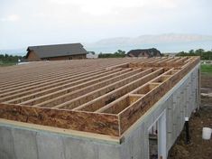 an unfinished roof is being built on a house