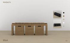 an image of a table and two bins on the floor in front of a white wall