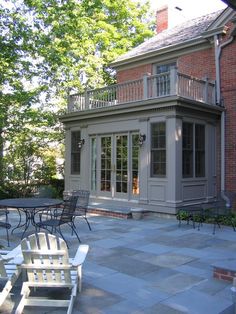 an outdoor patio with tables and chairs