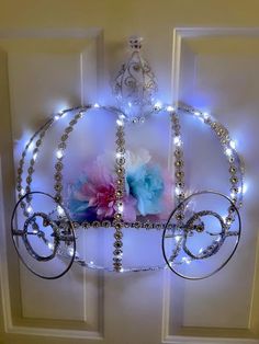 a light up carriage with flowers on it