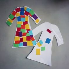 two pieces of paper are cut out to look like clothes with colored squares on them