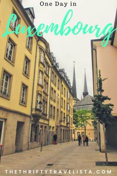 an old city street with people walking on it and the words one day in luceenburg