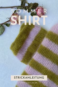 a knitted striped scarf next to a pink rose on a white surface with text that reads, sommer shirt