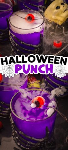 halloween punch recipe with purple liquid and sprinkles on the rim, surrounded by candy