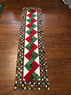 a christmas table runner on the floor