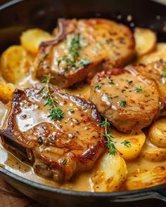 some meat and potatoes are in a pan