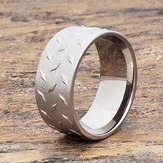 a silver ring with an intricate design on it